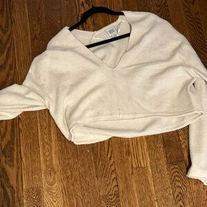 Off White Urban Outfitters cropped v neck sweater.
